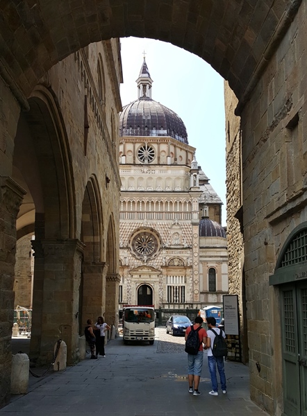 Bergamo cathedral from under an arch